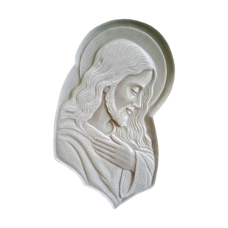 Scultura a bassorilievo sagomata di Gesù di profilo rifinita a mano, disponibile in marmo e resina per personalizzazione lapidi